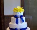 Wedding cake topped with yellow callas