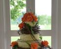 Orange roses and grapevine brides cake