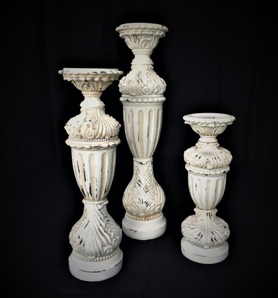 Set includes:1-19", 1-15" & 1-12" Candle Holder and includes 3 Glass Holders for Votives (not pictured). 8 Sets Available @ $35 per set. High-quality Resin. Like New Condition. 