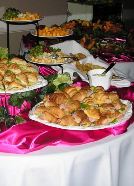 A delicious assortment of sandwiches and other hors d'oeuvres.